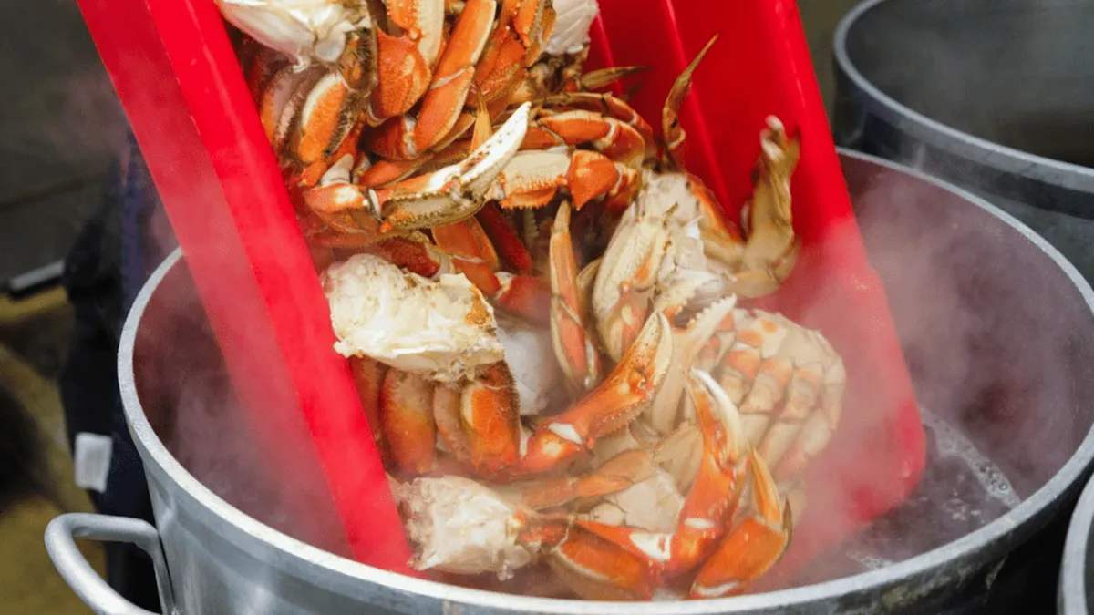 A tray of Dungeness crab and corn served at the lodge over the water on the George Inlet crab feast tour from Ketchikan, Alaska