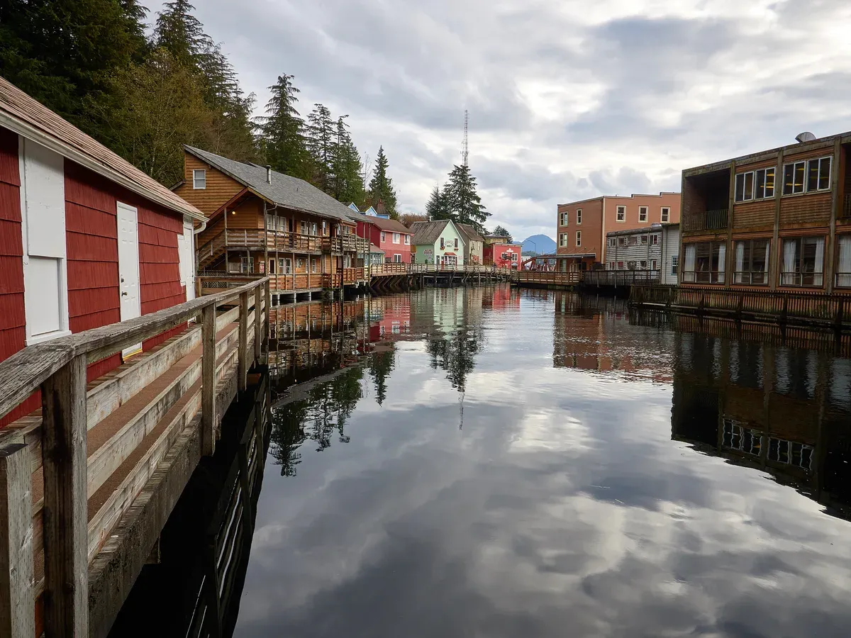 Painted houses on pilings along the Creek Street boardwalk above Ketchikan Creek in Ketchikan, Alaska